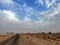 Landscape view of desert with a single road in sunny morning in western sahara