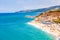 Landscape view on famous Rotonda Beach full of resting sunbathing and swimming people. Popular sea beach in Tropea, Italy