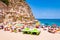 Landscape view on famous Rotonda Beach under the cliff full of sunbathing and swimming people. Popular landmark in Tropea city,