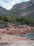 Landscape view of Freycinet Peninsula,Tasmania cliffs shores with plants by water, Australia