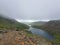 Landscape view of the geen Snowdon Mountain range in Wales under a gloomy sky