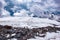 Landscape view of glacier and alpinists climbing by the path.