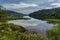 Landscape view of Glencar Lough in western Ireland with sky reflections in the calm lake water