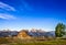 Landscape view of Grand Teton mountain range and abandoned barn