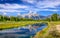 Landscape view of Grand Teton mountains with water reflection,