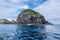 Landscape view with of a hole in the rock, Piercy Island, New Zealand