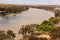 Landscape view of houseboat cruising upstream on the Murray River near Young Husband in South Australia