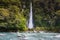 The landscape view of jungle with a Waterfall-River-rocks-covered-with rainy forest-Waterfall in the forest at park