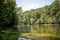 Landscape view of the lake in the Belgrad Forest, Istanbul with lush trees reflected on water