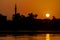 Landscape view of large river at sunset with minaret