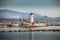 Landscape view of lighthouse tower at marina La Duquesa with La Concha mountain in background