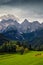 Landscape view of mountain peaks, autumn foliage, meadow and cows, Triglav NP, Slovenia