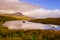 Landscape view of Old Man of Storr rock formation and lake, Scotland