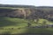 Landscape view over the valley with trees and fields