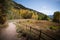 Landscape view of pathway with mountains and fall foliage near Aspen, Colorado.