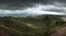 Landscape view from Pen y fan peak in Brecon Beacons with dark m