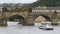 Landscape view of Prague Bridge and Water Bus Boat Floating on the River Vltava