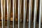 Landscape view of a rank of shiny steel pipes of a refurbished church organ