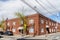 Landscape view of the red brick Warwick Valley Telephone Building on Main Street in Warwick