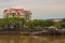 Landscape with a view of the river and beautiful multi-colored building. Kuching, Sarawak, Malaysia