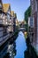 Landscape view of river Great Stour passing between houses.