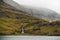 Landscape view of Saksun village waterfall and lake