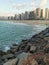 Landscape View of the sea and people in the sand and buildings at Praia de Iracema Beach, Fortaleza, CearÃ¡ Brazil