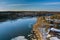 Landscape view on the shore of the river floating ice drifting floes on the frozen river