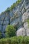 Landscape view of a steep, majestic and rocky mountain cliff on a clear day during summer. Closeup of rocks on a natural