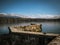 Landscape view of a stone jetty on Lake Geneva with Mont Blanc in the background.