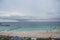 Landscape view of tawean beach with crowded of tourist on the beach in cloudy day.