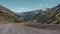 Landscape view of an unpaved road and valley