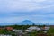 Landscape views of the majestic volcano Agung over the rooftops of the town at its foot