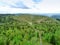 The landscape of the village with a vineyard, forest, hills.