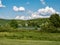 Landscape vista in Moraine State Park, in Southwest Pennsylvania in the evening.  Fields of green with Lake Arthur surrounded by