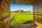 Landscape of Wat Tham Sua Temple Tiger Cave Temple with Jasmine rice fields and bamboo frame at Kanchanaburi Province