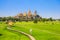 Landscape of Wat Tham Sua Temple Tiger Cave Temple with Jasmine rice fields at Kanchanaburi Province, Thailand.