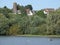 Landscape water boat bird trees buildings