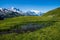 Landscape of wet grass hills and houses in charamillon gondola alps in Haute Savoie, France