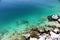 Landscape of white rock formations and body of water, lagoon of turquoise blue colors. Laguna de Alchichica, Puebla Mexico