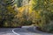 Landscape with a winding highway with mountain ranges overgrown with wild forest with autumn trees in Columbia Gorge region