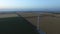 Landscape with windmills and farm fields at dusk. Aerial survey