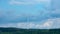 Landscape with windmills under the clody sky