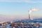 Landscape of a winter industrial zone with smoking chimneys