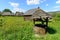 Landscape with wooden fountain and country houses Romanian