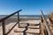 Landscape of wooden stairs on a beach under the sunlight in Fohr, Germany