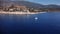 Landscape of yacht swimming in the sea next to the coastline and ancient mountain city Kas in Turkey