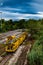 Landscape with yellow freight train stationary