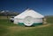 Landscape of yurt traditional nomadic homes for Western Mongolians on the steppe with beautiful blue sky