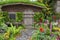 Landscaped backyard of a old house with flowering garden